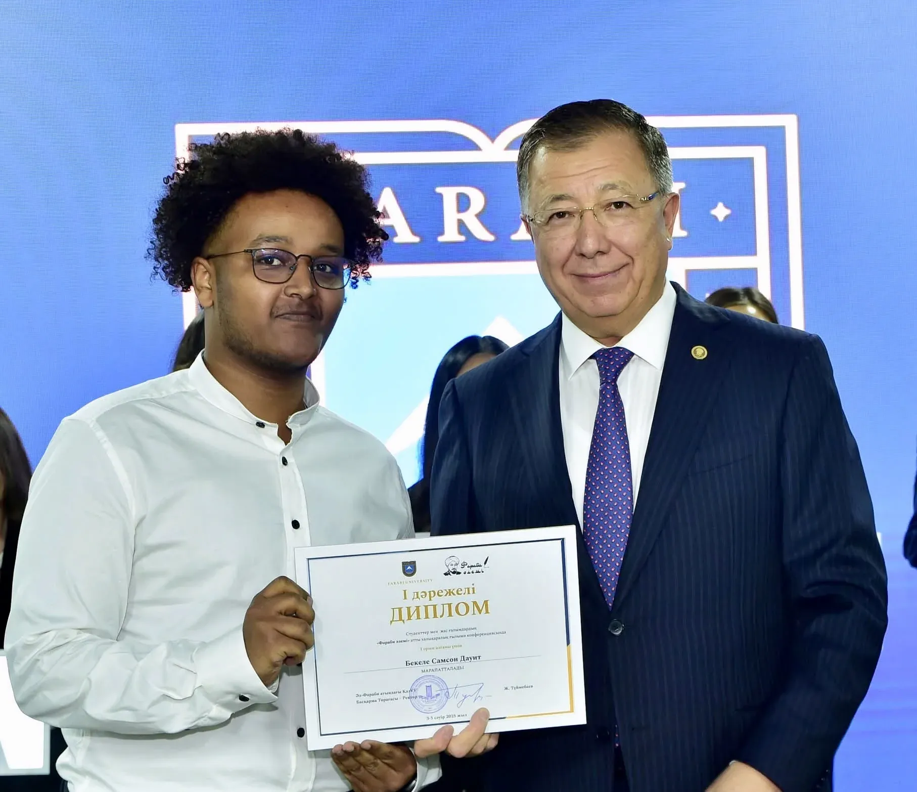 Receiving my first-place award in the Farabi Alemi 2025 plenary competition from the university rector during the awards ceremony with winners from all faculties.
